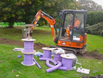 City Fibre's tools of the trade, a digger and purple ducts for the cables           
